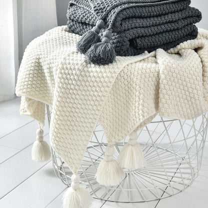 Couverture plaid avec pompons