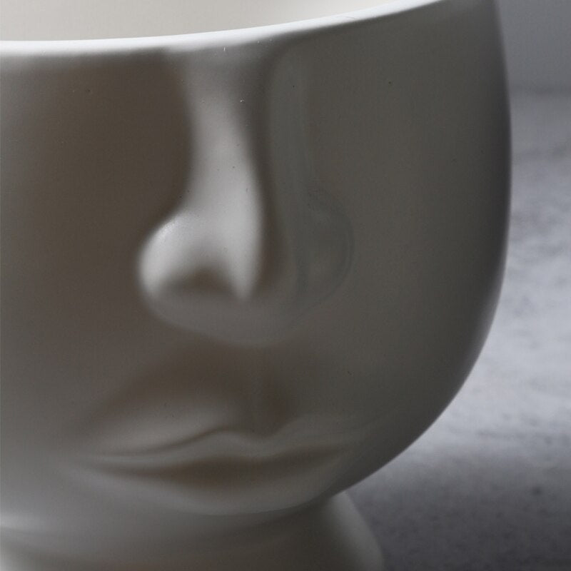 Cache-pot visage