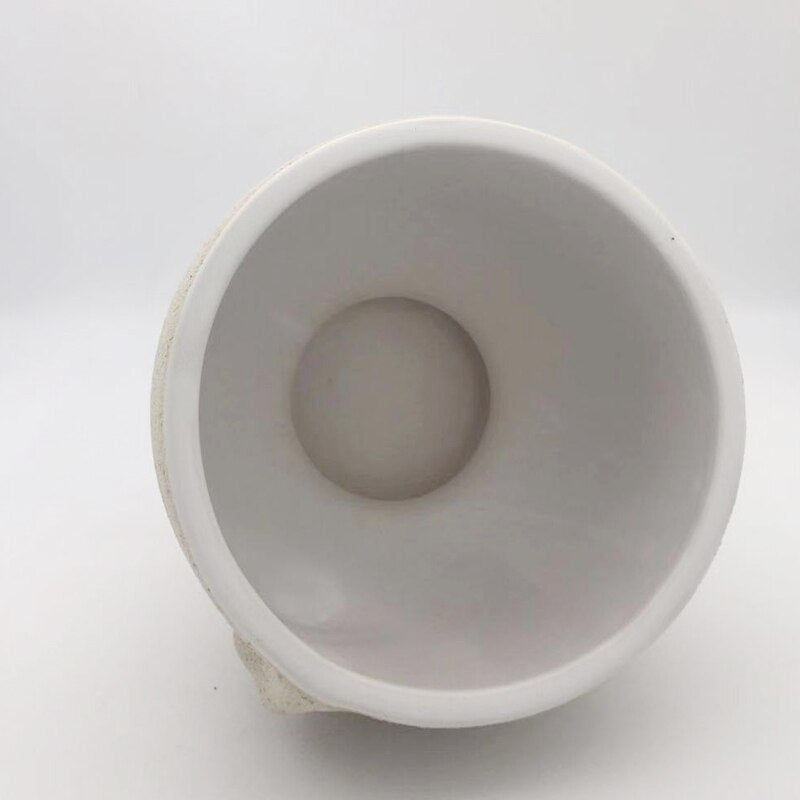 Cache-pot visage